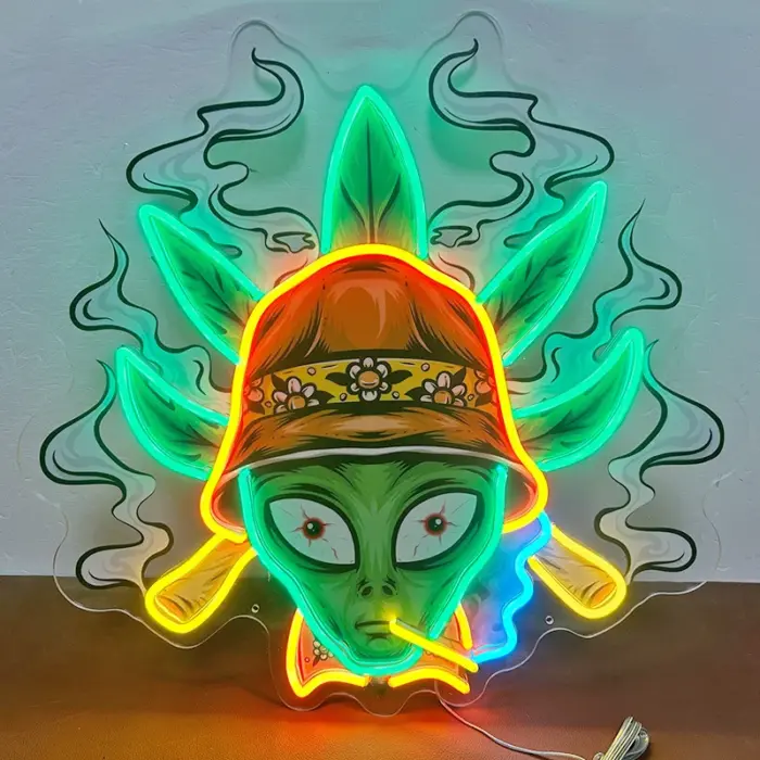 Alien avatar UV print neon sign with glowing hat and green smoke background.