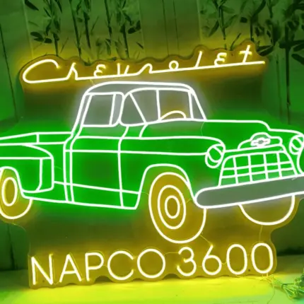 Vintage car multicolored neon sign in green and yellow with NAPCO 3600 and Chevrolet design.