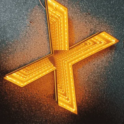 X-shaped Melaleuca Magic Neon Mirror neon sign in vivid orange-yellow color