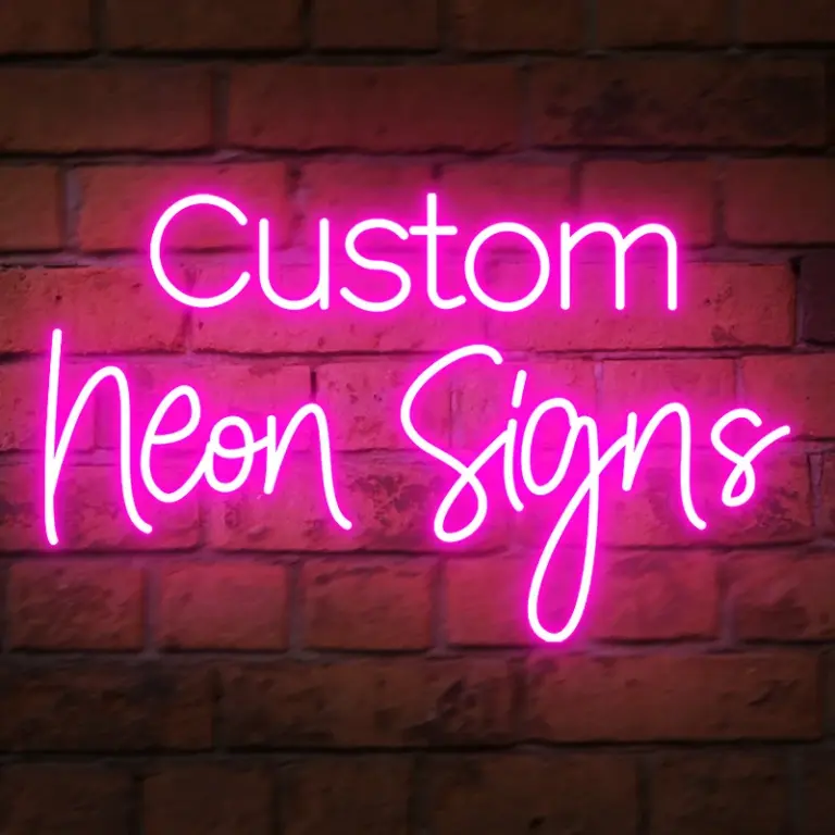 Pink LED neon light spelling “Custom Neon Signs” for decorative display or advertising use.