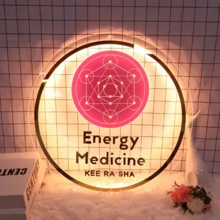 Personalized round neon business logo on transparent acrylic with warm white lighting.