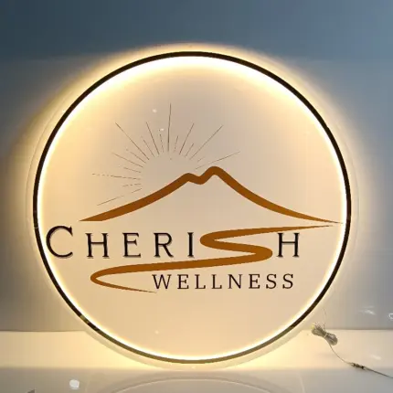 Personalized round neon business logo sign with CHERISH WELLNESS branding and warm white LED lights.