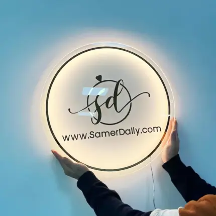 Personalized round neon business logo sign with Samer Dally branding and website URL on transparent acrylic.