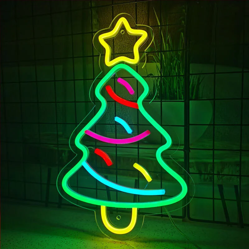 Christmas tree-shaped neon sign with yellow trunk, green leaf outline, and yellow star on top