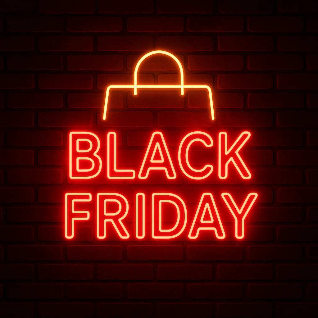 Black Friday neon sign glowing in red with a shopping bag outline on a dark brick wall background.